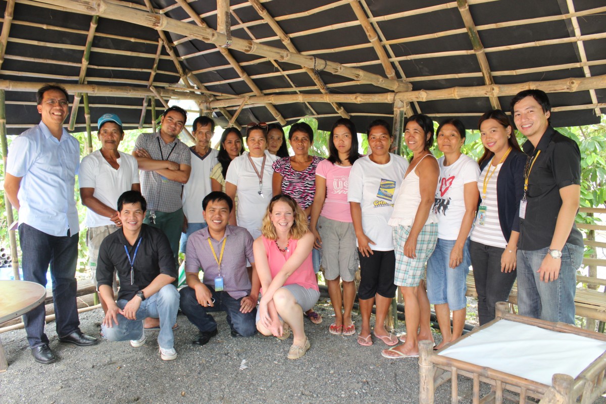 ASKI and Grameen Foundation staff with ASKI clients